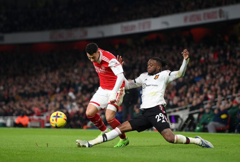 Gabriel Martinelli of Arsenal is challenged by Aaron Wan-Bissaka.